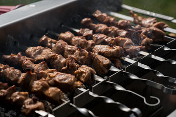 Grilling shashlik on barbecue grill, only pork.