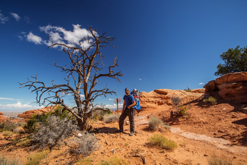 Obraz premium A family with baby son visits Arches National Park in Utah, USA
