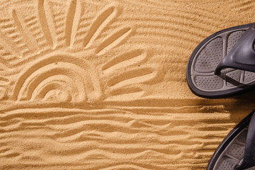 Slippers sands on the beach in the sand stuck to the sneakers with sun