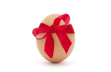 Easter egg with red ribbon isolated on white background 