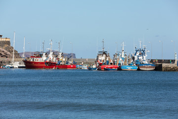 Fototapeta premium Fishing boats in Machico on Madeira Island, Portugal