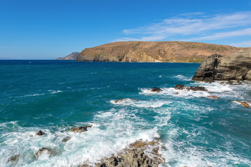 View of cliffs and waves in windy day. Papafragas beach, one of the most impressive sites of Milos. Cyclades, Greece