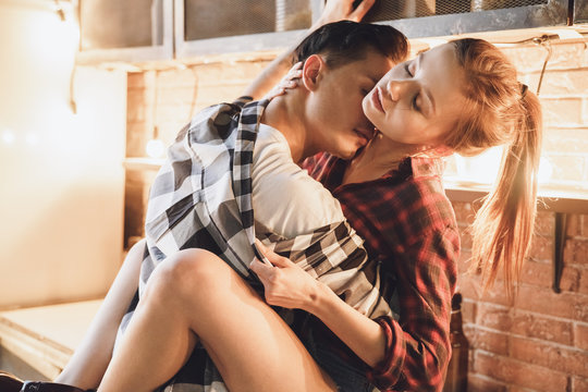 Romantic dinner concept. Kissing, unclothe and undressing