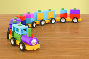 Wooden toy train with colorful blocs on the wooden table. 3D rendering