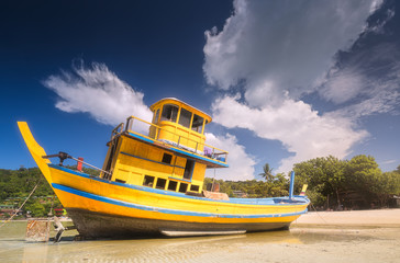 Old boat on white beach Phi Phi Island, Thailand