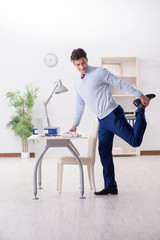 Employee doing stretching exercises in the office