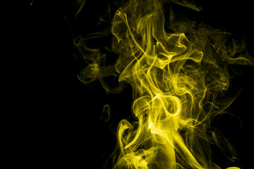 Yellow smoke on black background