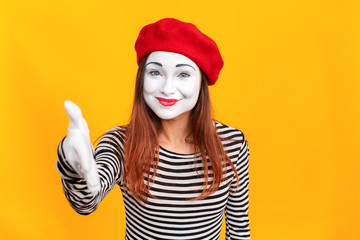 Handshake. Closeup portrait of mime woman showing hi, hello sign
