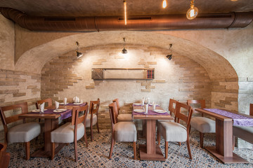 Restaurant interior with brick wall and vintage tiles