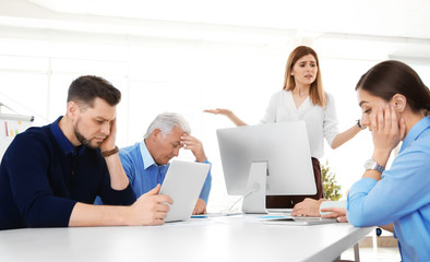 Office employees having argument during business meeting