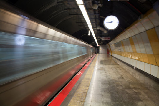 Blurry motion image of subway train in Istanbul subway station.