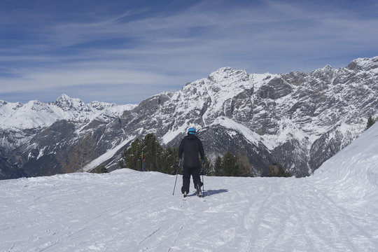 Skier at mounties hight at sunny day