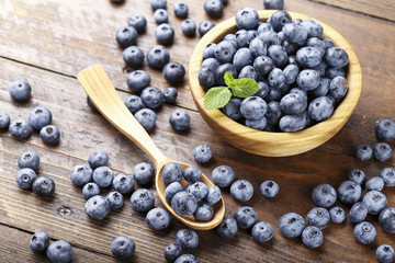 ripe organic bog whortleberry in a wooden plate
