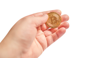 Golden Bitcoin in a man's hand