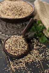 Mix of organic white, yellow and black quinoa, dietary and healthy food