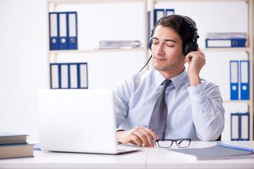Sales assistant listening to music during lunch break