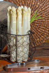 Bunch of raw uncooked fresh white asparagus high quality new harvest, ready to cook for dinner close up