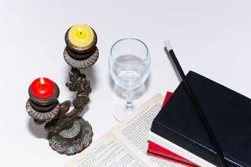 Book and candlestick