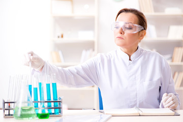 Woman chemist working in hospital clinic lab