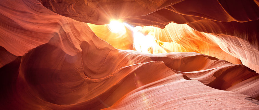 Sunlight shines on the abstract forms of Antelope Canyon.