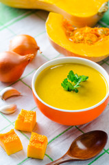 Pumpkin soup served on the table in bowl