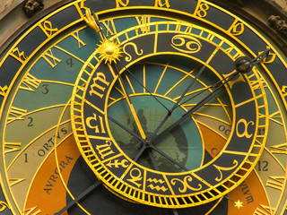 Naklejka premium The famous Astronomical Clock at the southern side of the Old Town Hall Tower in Prague, Czech Republic