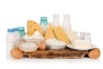 Fototapeta na wymiar Fresh dairy products and eggs on white background
