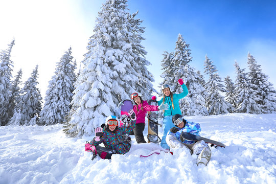 Friends at snowy ski resort. Winter vacation