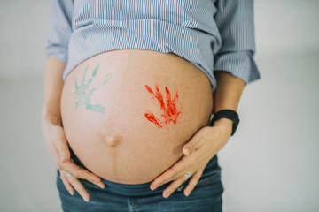 woman pregnant belly with child prints