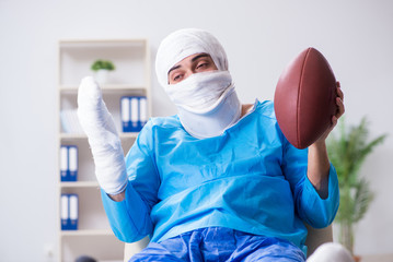 Fototapeta na wymiar Injured american football player recovering in hospital