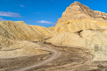 Golden Canyon Trail - A close-up midday view of Golden Canyon Trail at base of Manly Beacon, Death Valley National Park, California, USA.