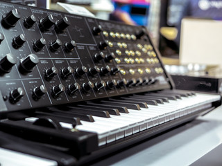 vintage analig synthesizer with piano keys close up