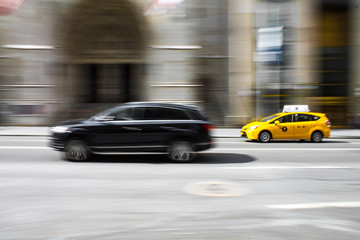 Fototapeta na wymiar City Taxi Speeding Fast Blur