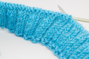 Fototapeta premium Knitting with a blue wool