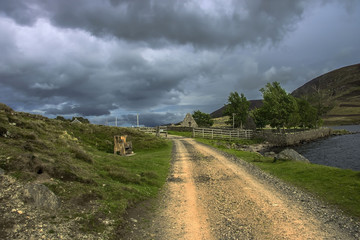 Fototapeta na wymiar Pathway around Loch Lee, Angus, Aberdeenshire, Scotland, UK. Cairngorms, south of the Grampian Mountains.