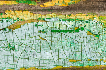 textured green-yellow peeling paint