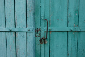 Old plank wooden wall background. The texture of old wood. Weathered piece of wood.