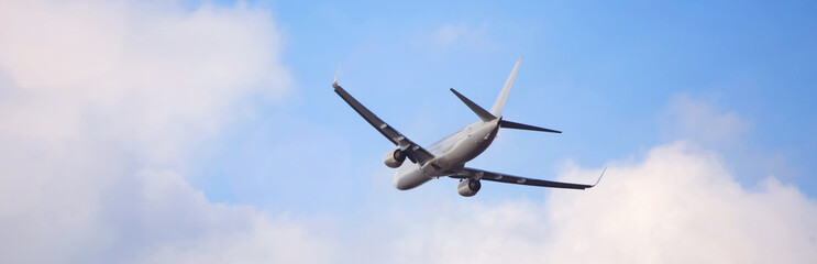plain passenger airplane starting in a cloudscape