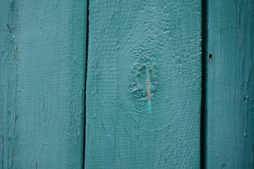 Old plank wooden wall background. The texture of old wood. Weathered piece of wood.