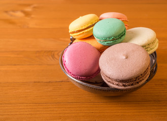 Tasty sweet macarons. Macaroons on old table.