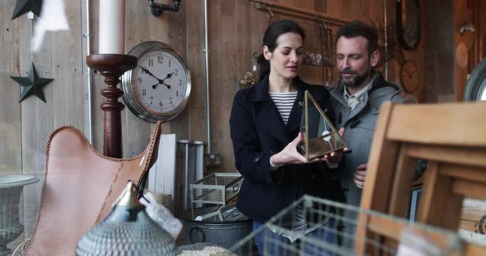Couple looking shopping in vintage antique store