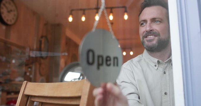Small business owner opening store