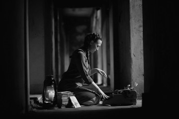 Retro girl in the old house reading books