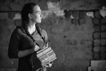 Retro girl in the old house reading books