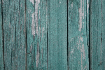 Wall texture background with peeling old paint. Old plank wooden wall background.