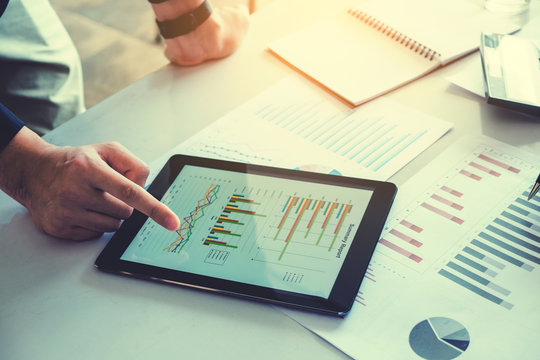 Business team meeting working on digital tablet new business project