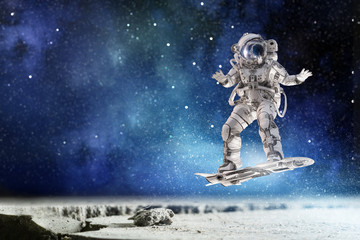 Spaceman on flying board. Mixed media