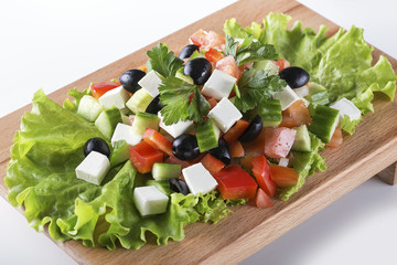 Greek salad with fresh vegetables, feta cheese and black olives for dieting