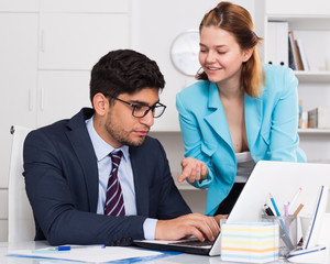 Business partners working in office