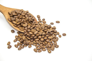 Coffee beans in wooden spoon on white background